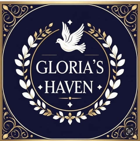 Elegant logo for Glorias Haven featuring a white dove with laurel wreaths on a dark navy blue background with gold ornamental border